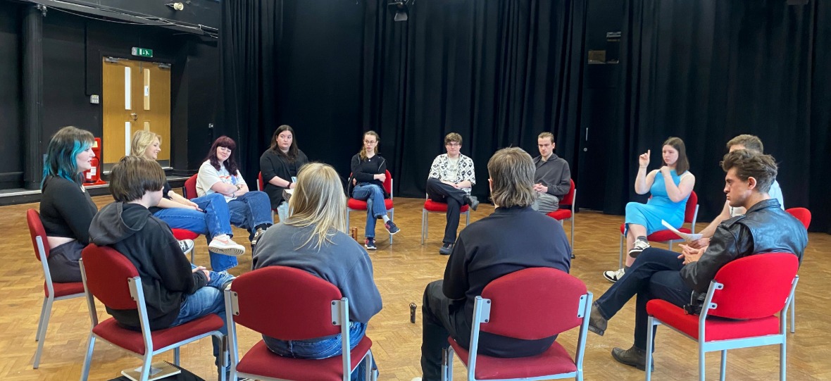 Large Web Image (2) University students sitting in a circle taking part in a workshop.