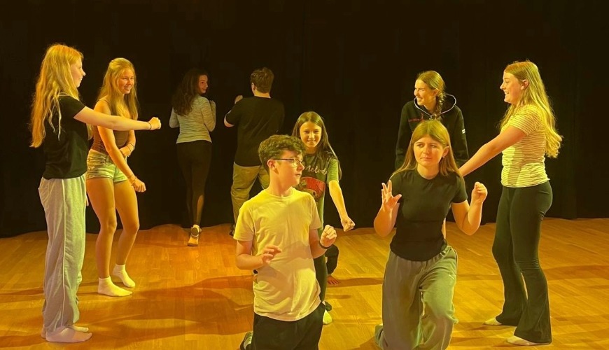young people participating in an activity at the performing arts summer school