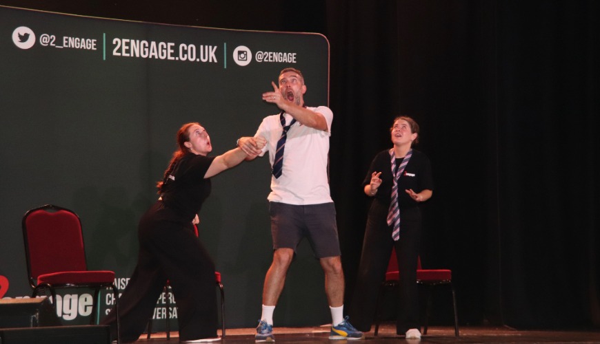 3 actors on stage performing the moving up show